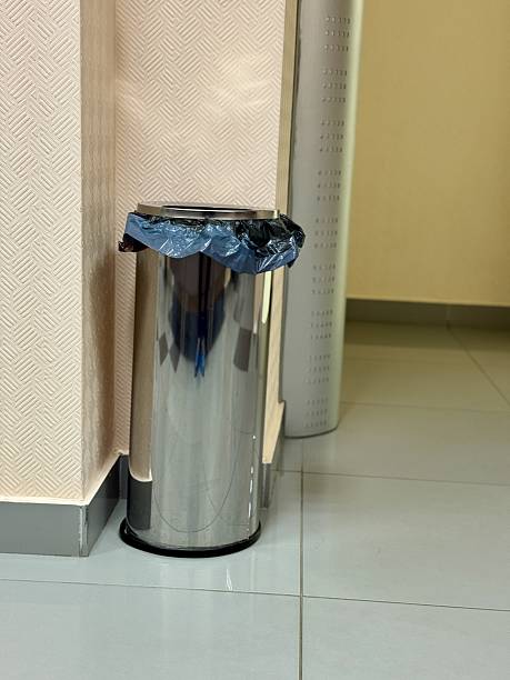 istock Contemporary Stainless Steel Trash Bin, Polished Chrome Waste Container Situated In Corridor Setting, Refined Stainless Steel Waste Disposal Unit With Liner In Hallway Environment 2254369754