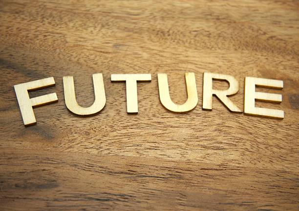 istock Future concept with wooden letters on wood material background copy space 2254381513