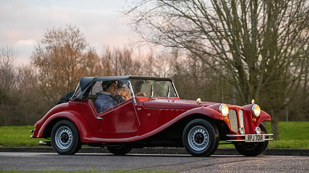 Milton Keynes,Bucks,UK - Jan 1st 2026:  1977 red Pilgrim Bulldog classic car driving on a British road