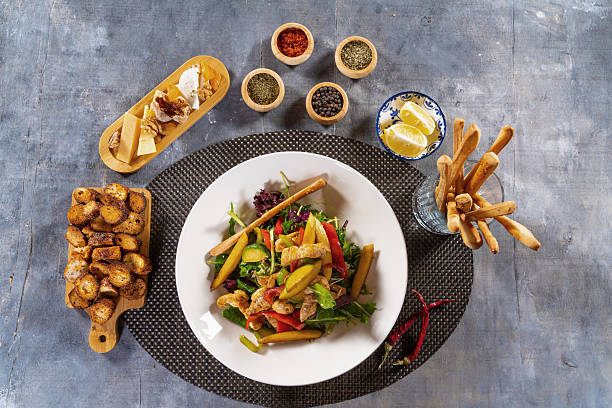 Healthy Grilled Chicken Salad with Colorful Vegetables in a White Bowl