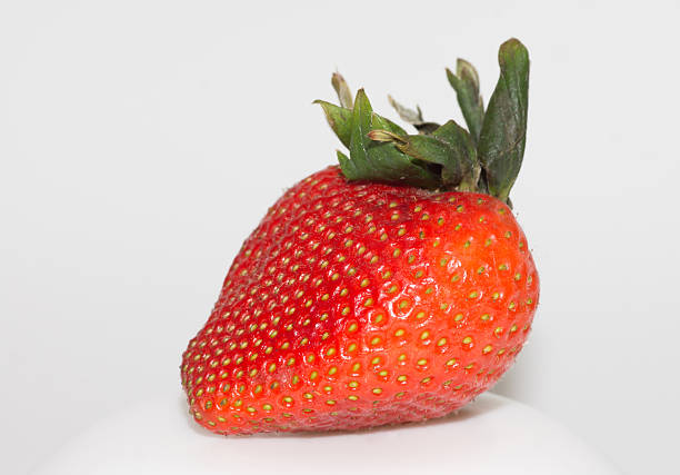 large red strawberry isolated on white background