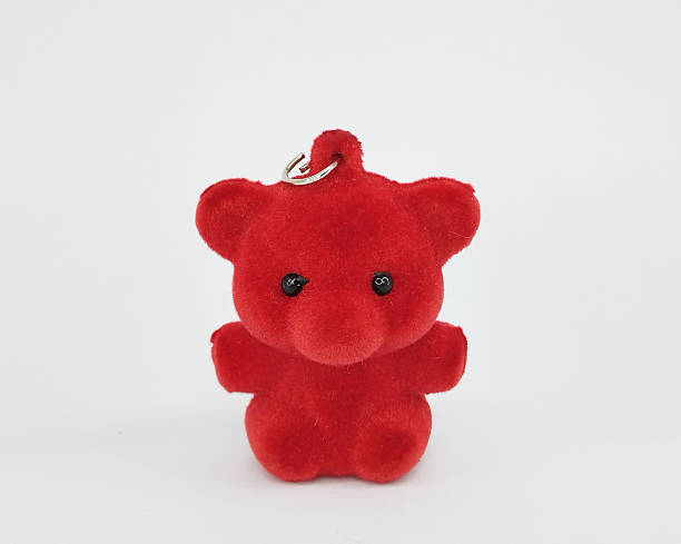 istock Small Red Fuzzy Teddy Bear Keychain On White 2254384207