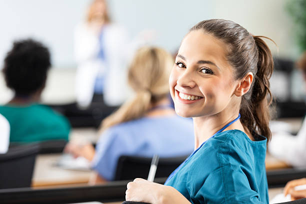 istock Young female student smiling confidently during a medical education lecture in a classroom setting. 2254387054