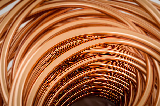 Abstract 3D render of flowing copper metal curves creating a dynamic industrial background. Concept of energy, technology, conductivity, data flow and modern engineering with warm metallic tones and smooth reflective surfaces.