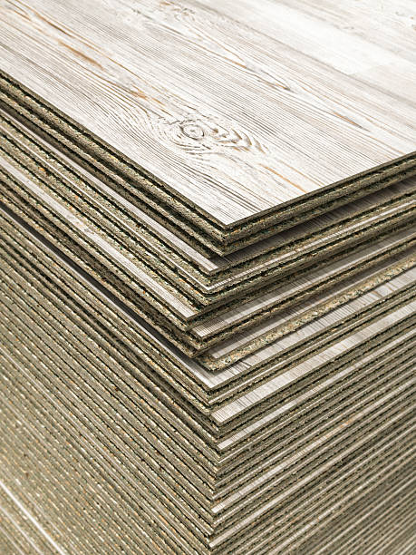 istock Stack of neatly organized tongue and groove laminated OSB sheets for flooring 2254391496