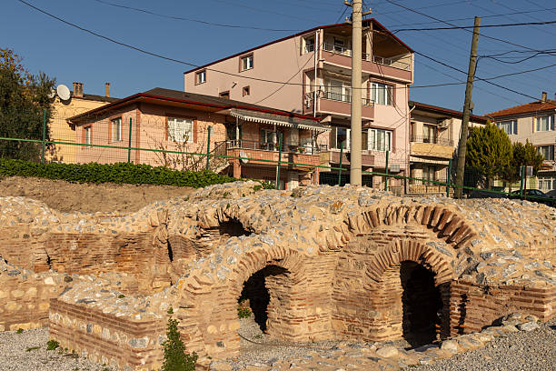 istock Ancient iznik roman bath ruins with modern buildings 2254391550
