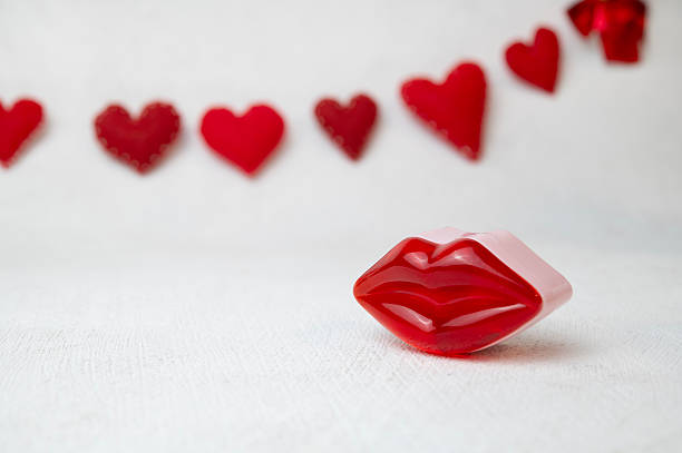 Happy Galentine`s day greeting card. Red lips against a garland of hearts