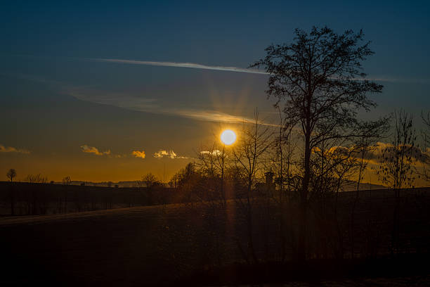Winter cold afternoon orange sunset in area of Liberec