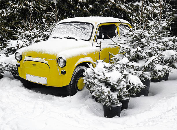 Classic French 2CV car parked on the side of the street during winter in the city of Zwolle, The Netherlands.