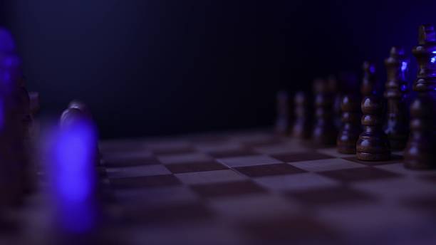 istock Chess pieces in motion on spinning board, intellectual game strategy concept 2254397581