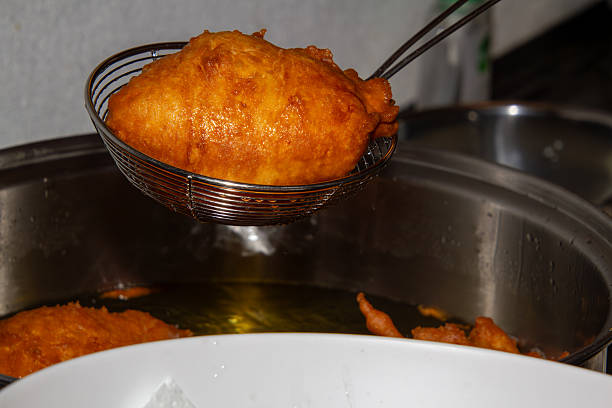 istock Frying doughnuts for new years eve 2254398965