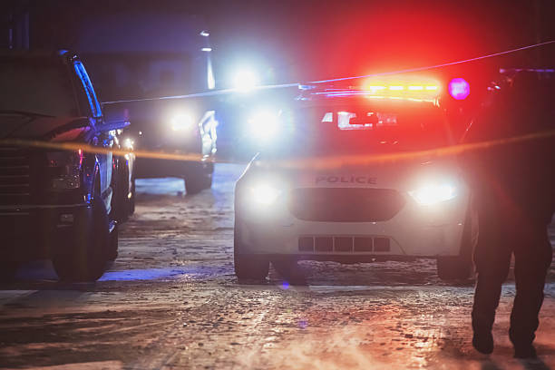 A BMW Series 7 vehicle of the NSW Police Highway Patrol with siren going and emergency lights flashing heads towards Bondi Beach. This image was taken on Bondi Road, near the corner of Wellington Street, Bondi on a cold evening on 8 June 2024.