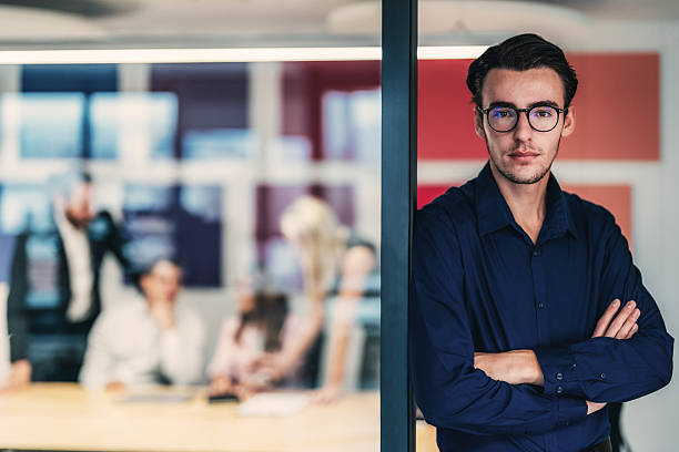 istock Ambitious young businessman in corporate workplace 2254404407