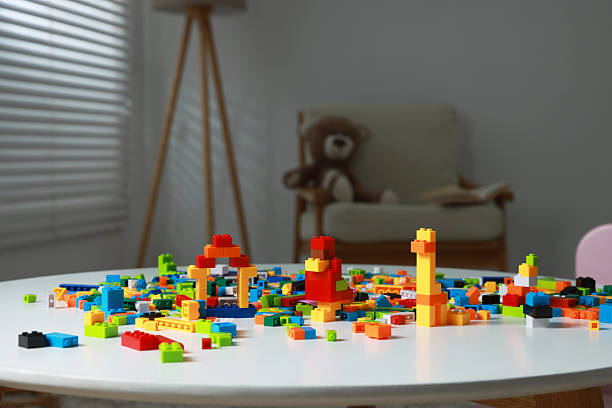 Construction toy. Colorful building blocks white table indoors