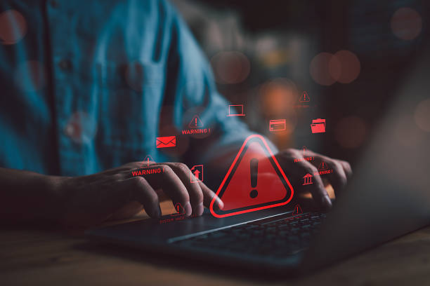 istock Cybersecurity concept showing warning alert on laptop screen, symbolizing data breach, hacking attack, and online threats in digital business environment. 2254409605