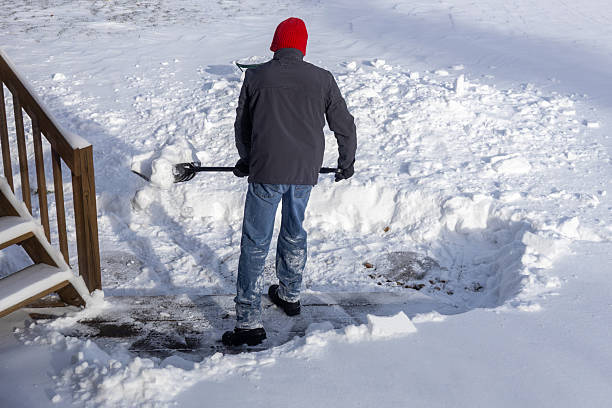 istock Unrecognizable adult man shoveling deep snow 2254410489