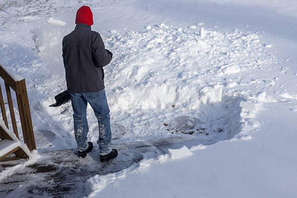 istock Unrecognizable adult man shoveling deep snow 2254410494