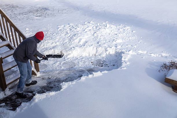 istock Unrecognizable adult man shoveling deep snow 2254410495
