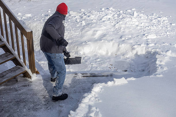 istock Unrecognizable adult man shoveling deep snow 2254410504