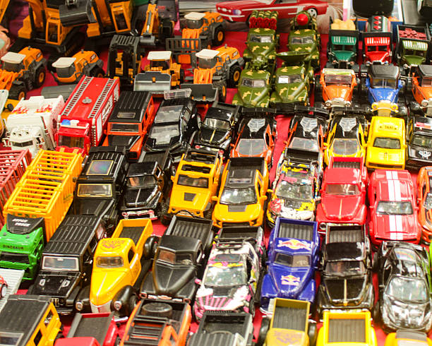 Close-up of a toy truck placed on colorful sensory balls in a children’s play area, representing fun, imagination, and early learning.