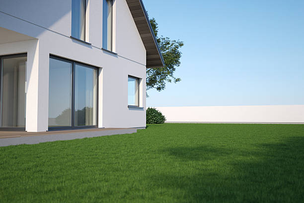 istock Modern house with green grass and sky, 3d illustration 2254411282