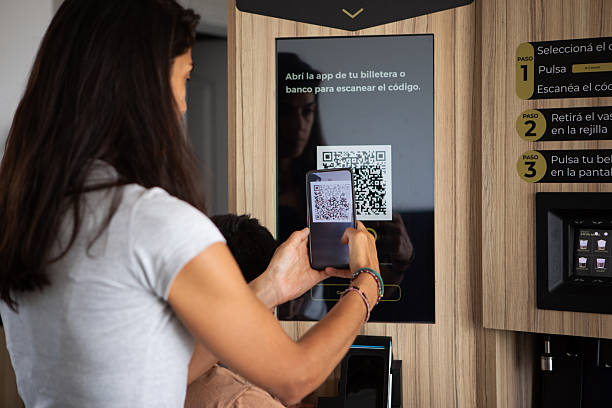 istock Mother and son bying a coffee from a  vending machine with artificial intelligence and robotics technology 2254411690