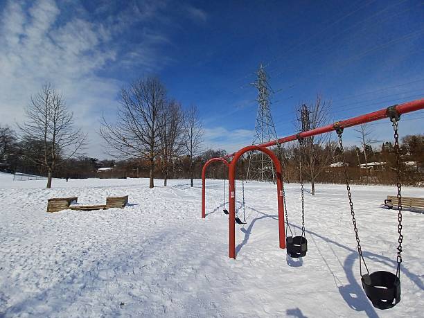 istock Empty children playground covered in snow 2254428226