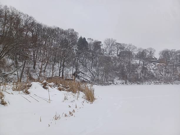 istock Wide valley riverbed covered in deep winter snow. 2254428951