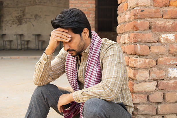 istock Young indian thoughtful sad man feeling alone. sadness, depression. Rural india. Unemployment 2254429468