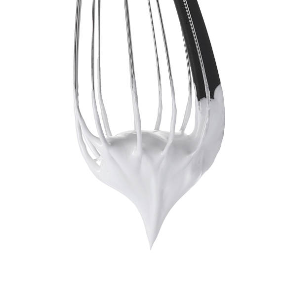 istock Whisk with whipped cream isolated on white 2254435320