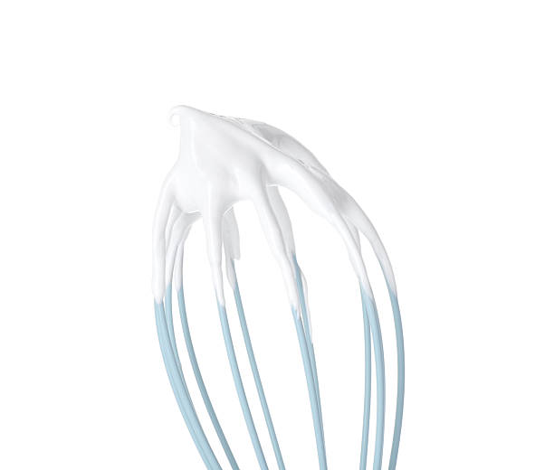 istock Whisk with whipped cream isolated on white 2254435349
