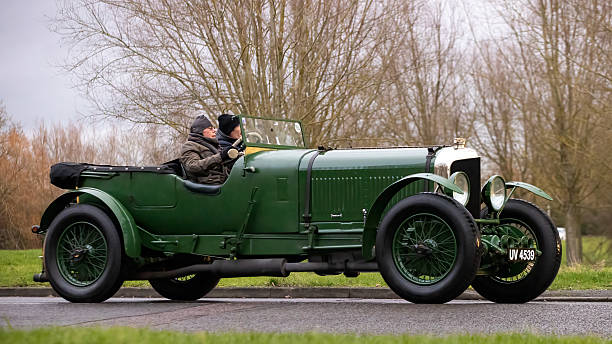 Milton Keynes,Bucks,UK - Jan 1st 2026: 1928 green Bentley Tourer vintage  classic car driving on a British road