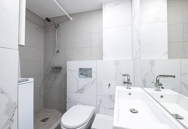 istock Modern Bathroom Interior with Sink, Toilet, Shower, and Washer Machine Design 2254441072