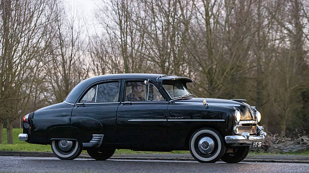 Milton Keynes,Bucks,UK - Jan 1st 2026:  1955 black Vauxhall Velox British classic car driving on a British road