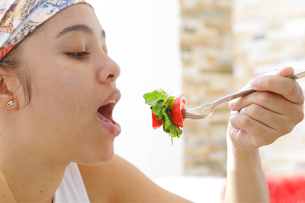 Sliced tomatoes for a tomato salad in a white plate
