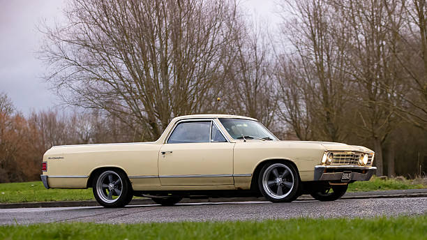 Milton Keynes,Bucks,UK - Jan 1st 2026:  1967 yellow Chevrolet El Camino  classic car driving on a British road