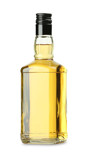 istock Whiskey in glass bottle isolated on white 2254448817