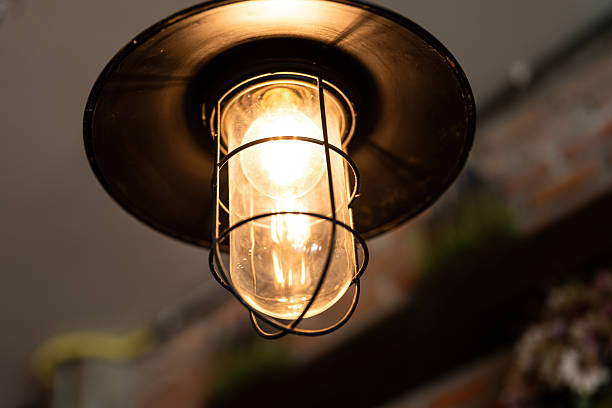 istock A classic style ceiling lighting lamp glowing in warmlight shade. 2254449114