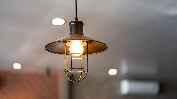 istock A classic style ceiling lighting lamp glowing in warmlight shade. 2254449123