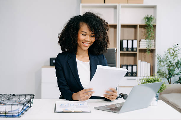 istock oung businesswoman working with working notepad, tablet and laptop documents talking on the smartphone, tablet 2254449488