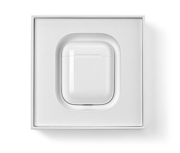 Apple airpods wireless charging case resting in its white retail box