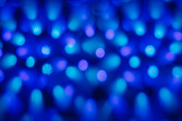 Soft blue bokeh lights create an abstract background with a dreamy ambiance, perfect for design projects, presentations, and artistic expressions with copy space
