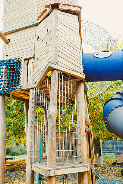 istock Colorful playground structure invites adventure and joy for children in a sunny park setting surrounded by vibrant autumn leaves 2254455686