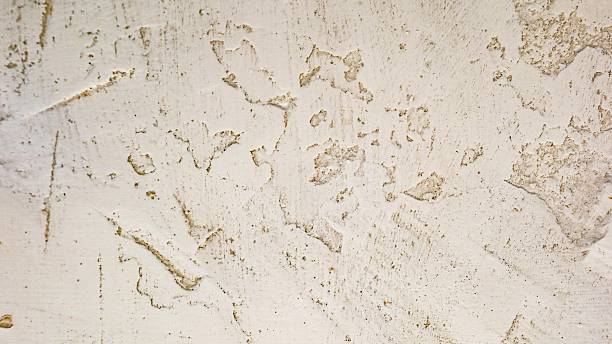 istock a close up view of a rustic plaster wall with a rough and textured finish 2254456178