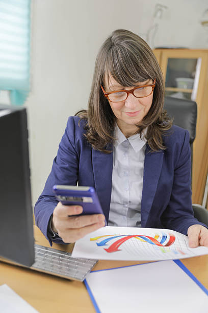 istock Woman Organizing Financial Documents During Tax Filing Process 2254457005
