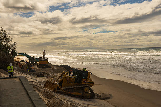istock Heavy Machinery Conducts Beach Erosion Control Work 2254457316