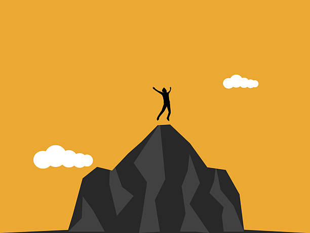istock businessman jumped for joy on top of the high mountain 2254457788