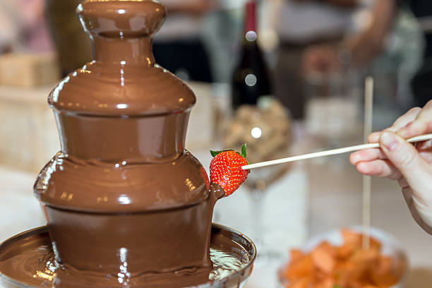 Sprinkle the melted chocolate on the stacked chocolates.