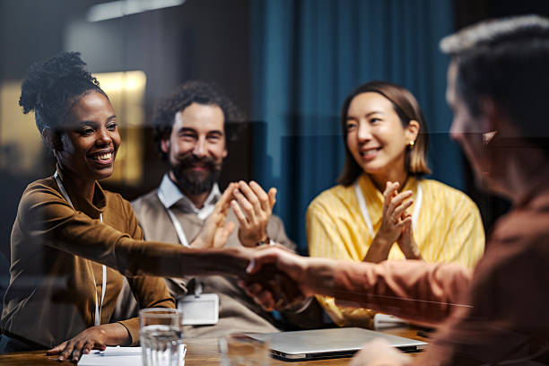 istock Business people having handshake during corporate meeting 2254458092