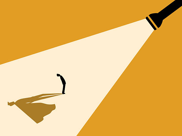 istock flashlight shone on the businessman, revealing the hero within him. 2254458173